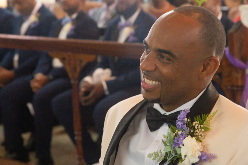 groom smiling during wedding